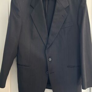 Mens dark grey suit. Jacket. 38” chest. Pants. 34” waist. 32” length.
